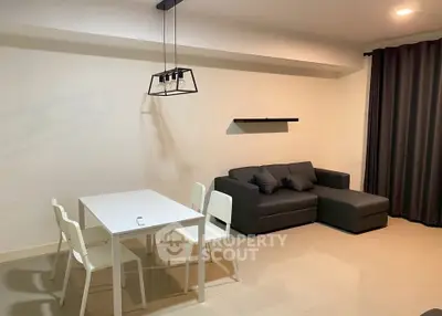 Modern living room with sleek furniture and stylish lighting, perfect for cozy gatherings.