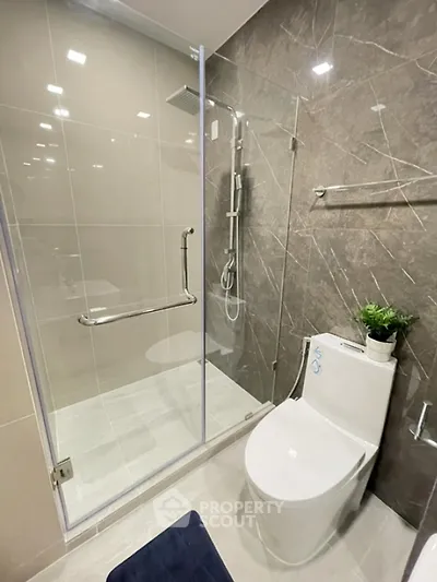 Modern bathroom with glass shower and sleek design