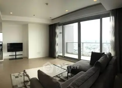 Spacious modern living room with large windows and city view