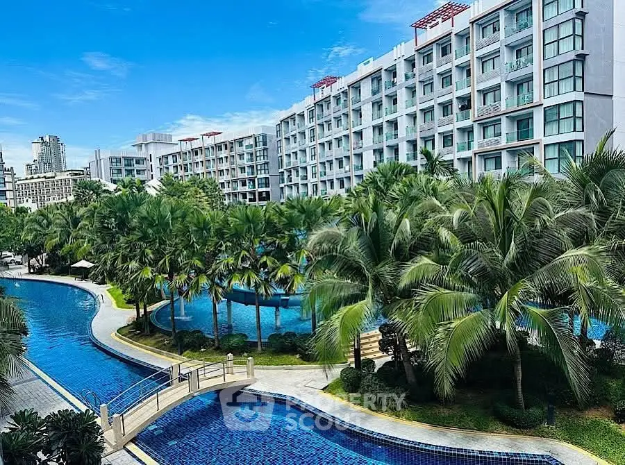 Luxurious condominium with stunning pool and lush greenery, perfect for modern living.