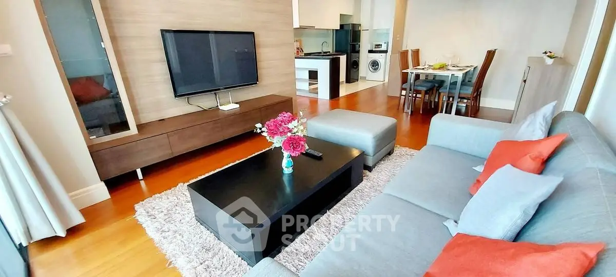 Modern living room with stylish decor and open kitchen layout