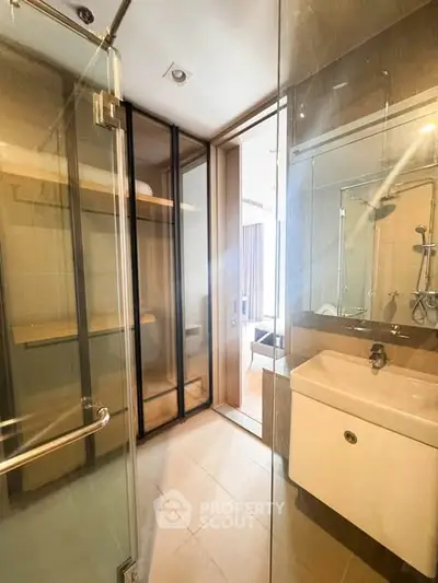 Modern bathroom with glass shower and sleek sink design