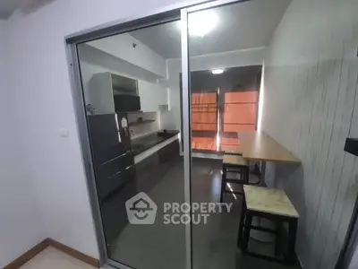 Modern kitchen with sleek design and breakfast bar seating