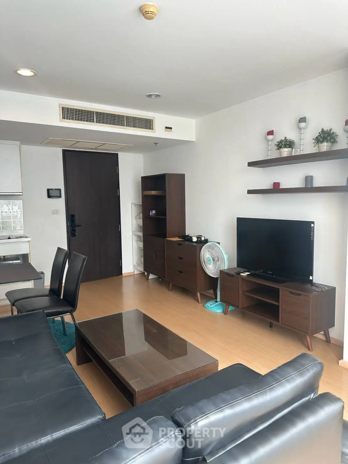Modern living room with sleek furniture and TV in a stylish apartment