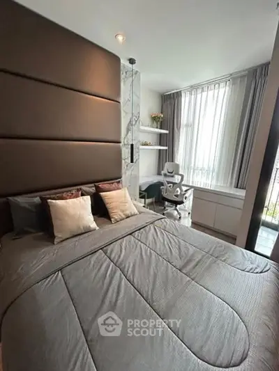 Modern bedroom with stylish decor and natural light