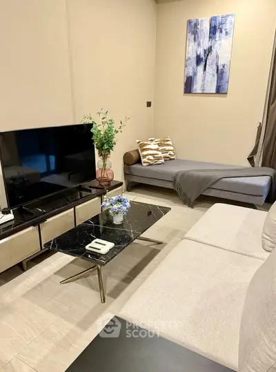 Stylish modern living room with elegant decor and cozy seating area.
