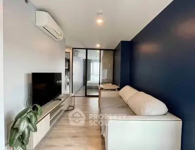 Modern living room with sleek design and cozy sofa in stylish apartment.