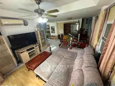 Spacious living room with cozy sectional sofa and entertainment center