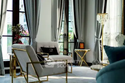 Luxurious living room with elegant decor and large windows for natural light.