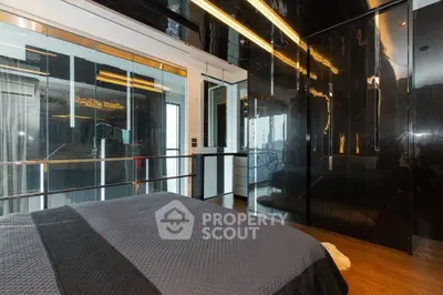 Luxurious modern bedroom with sleek black walls and elegant lighting