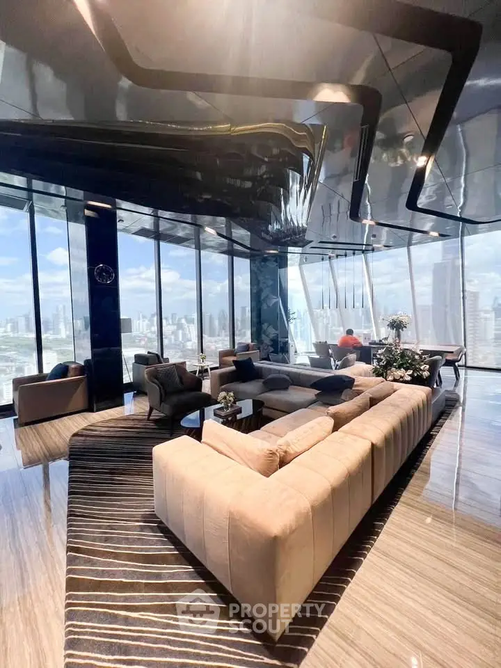 Luxurious high-rise living room with panoramic city views and modern decor.