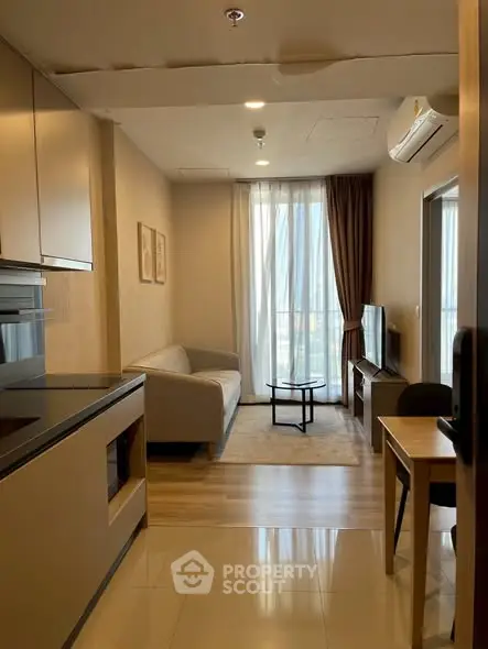 Modern living room with sleek furniture and natural light, perfect for urban living.