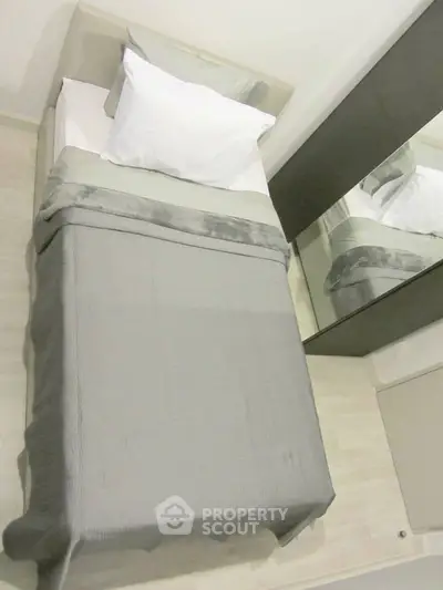 Cozy bedroom with modern design and mirrored wardrobe