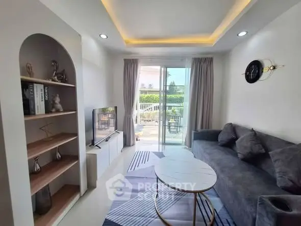 Modern living room with stylish decor and balcony view