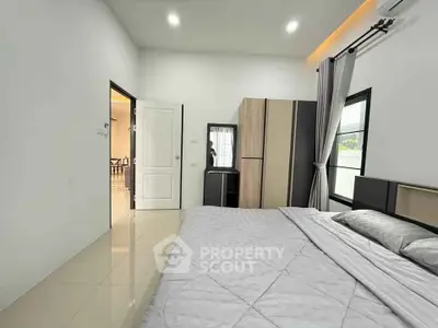 Modern bedroom with sleek design and ample natural light