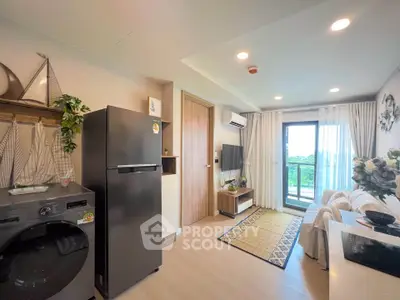 Modern living room with balcony view, featuring sleek appliances and stylish decor.