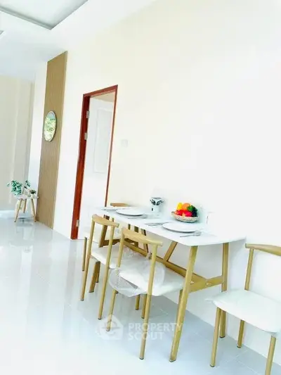 Bright dining area with modern wooden furniture and minimalist decor