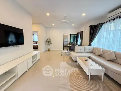 Spacious modern living room with elegant decor and natural light