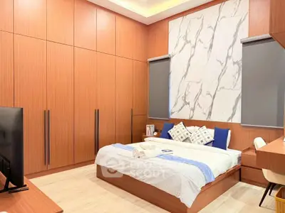 Modern bedroom with stylish wood paneling and marble accent wall, featuring a cozy bed and sleek furnishings.