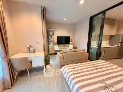 Modern studio apartment with open layout, featuring cozy living area, stylish kitchen, and elegant bedroom space.