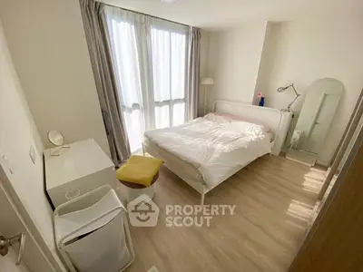 Bright and cozy bedroom with modern furnishings and natural light