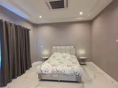 Luxurious bedroom with elegant marble flooring and modern decor