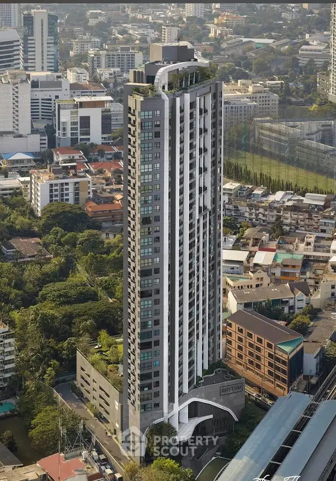 Stunning high-rise building with modern architecture in vibrant urban setting, offering panoramic city views.