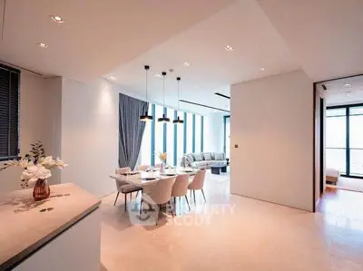 Spacious modern living and dining area with elegant decor and natural light