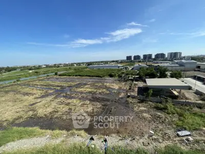 Expansive land plot with potential for development, offering scenic views and proximity to urban amenities.
