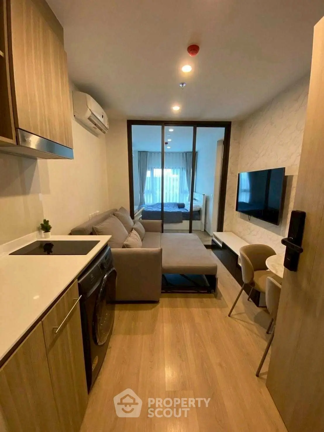 Modern studio apartment with open layout and stylish furnishings