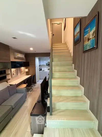 Modern duplex living room with staircase and stylish decor