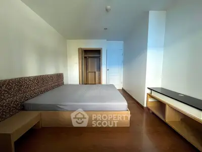 Spacious bedroom with modern design and ample natural light