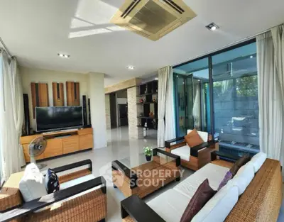 Spacious modern living room with stylish furniture and large windows