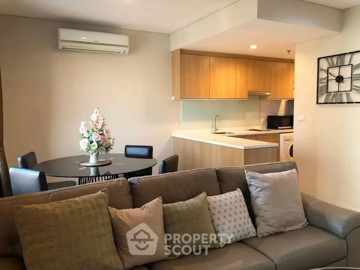 Modern living room with open kitchen and stylish decor