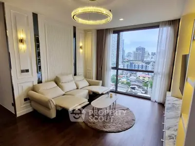 Luxurious living room with city view, modern decor, and elegant lighting in high-rise apartment.