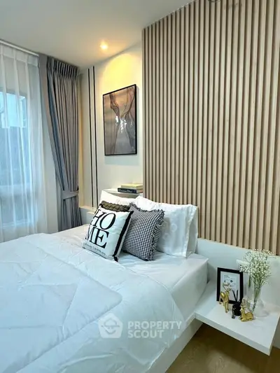 Modern bedroom with stylish decor and cozy ambiance, featuring elegant wood paneling and soft lighting.