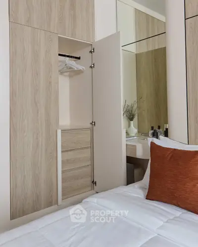 Modern bedroom with built-in wardrobe and cozy decor