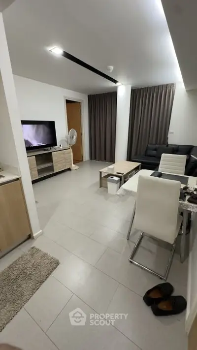 Modern living room with sleek furniture and neutral tones, perfect for cozy relaxation.