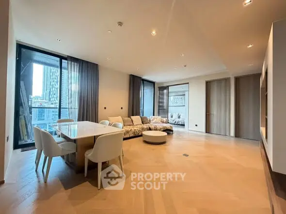 Spacious modern living room with elegant dining area and city view.