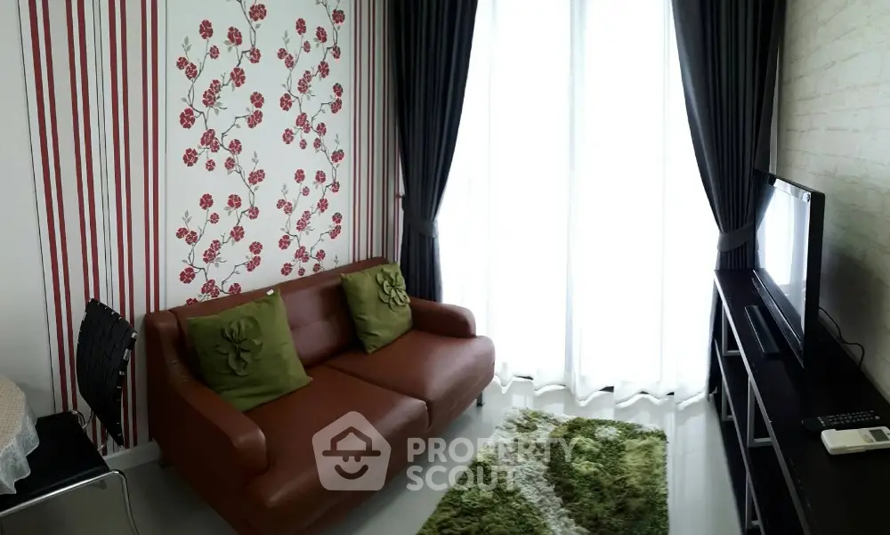 Charming living room with floral accent wall and cozy brown sofa