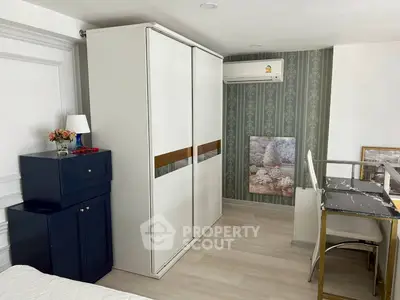 Stylish bedroom with modern wardrobe and elegant decor