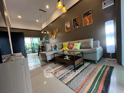 Stylish modern living room with cozy sectional sofa, vibrant decor, and elegant lighting in a contemporary home.