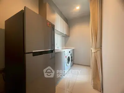 Modern kitchen with sleek appliances and ample storage space