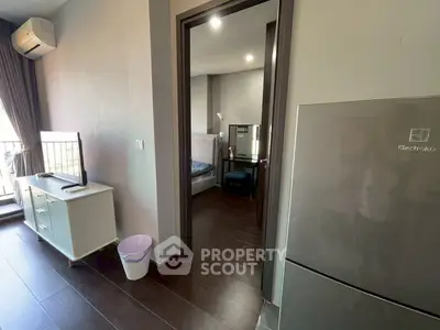 Modern apartment interior with sleek design, featuring a cozy bedroom and stylish living area.