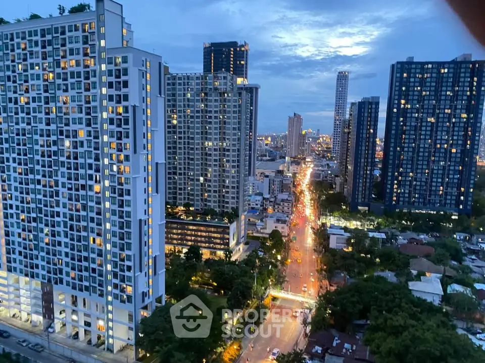 Stunning cityscape view of modern high-rise buildings at dusk, showcasing urban living and vibrant city lights.