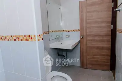 Modern bathroom with sleek fixtures and stylish tile accents