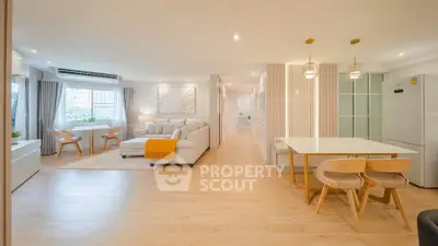 Spacious modern living room with open kitchen and elegant decor