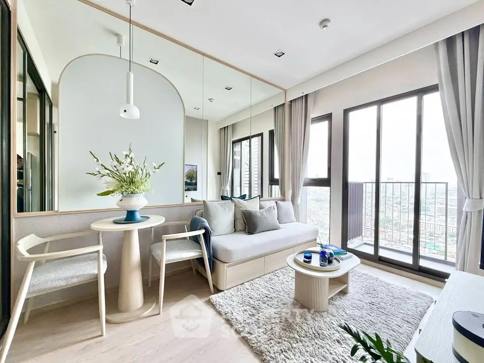 Bright modern living room with large windows and cozy decor