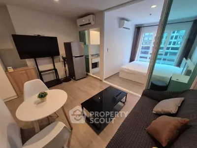 Modern studio apartment with open layout, featuring a cozy living area, sleek kitchen, and comfortable bedroom.
