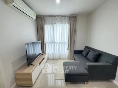 Modern living room with sleek furniture and natural light